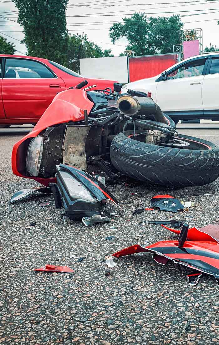 A motorcycle on the pavement after a collision